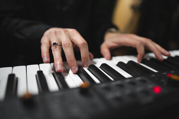 Fototapeta premium close-up of a pianist's hands while playing the piano