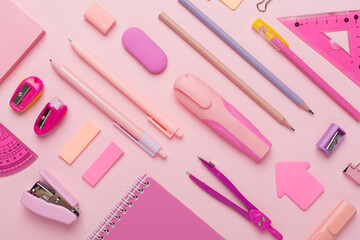 Pattern with pink school stationery on color backgroung, top view
