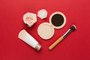 Composition with makeup products for skin tone on color background, top view