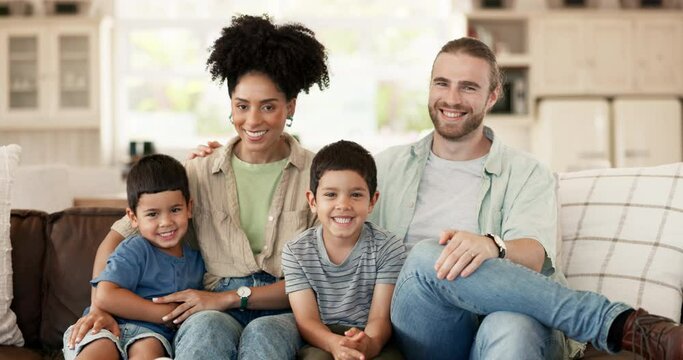 Smile, Love And Face Of A Family On Sofa For Relaxing And Bonding Together In The Living Room. Happy, Proud And Portrait Of Boy Children Sitting With Their Young Interracial Parents At Modern Home.