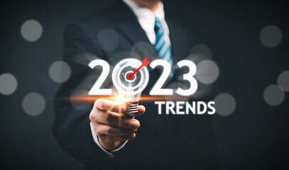 Businessman hand use magnifying glass Search for 2023 Trends information. Using Search Console for Trends data, info, Searching On Virtual Screen Data Search Technology Search Engine Optimization.