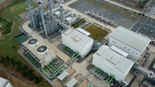 Dynamic industry and technology in action! High angle view of a gas turbine power plant driving the generator. Seamless energy management, showcasing innovation and efficiency.
