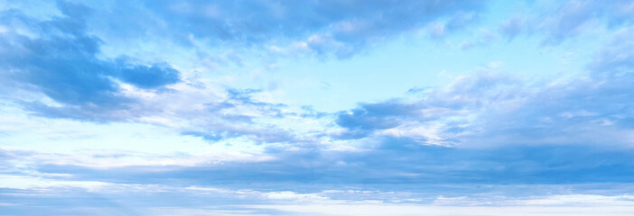 Blue sky background with white clouds. Beauty bright air background. Gloomy vivid cyan landscape.