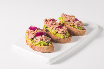 Toast with Canned Tuna. Fish open sandwich with red onion and lemon. 