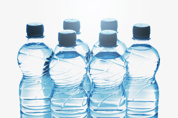 Blue bottles of pure still water against white background