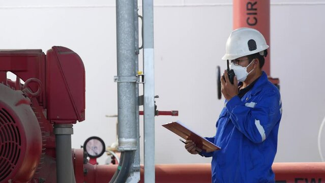 Engineer weekly check of Engine Fire Pump ensures safety and reliability in the industrial plant. Meticulously recorded in the logbook for availability. Safety and working concept in industrial plant