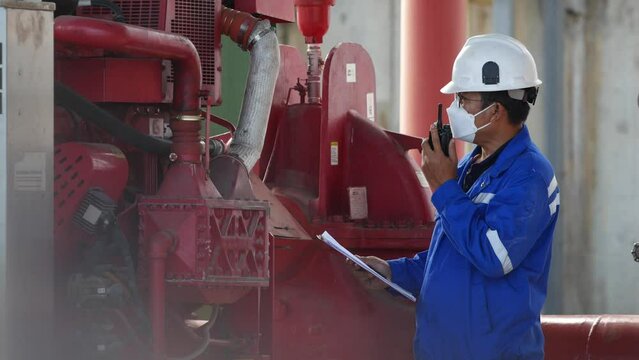 A weekly engine fire pump examination by an engineer ensures safety and dependability. recorded in the logbook for availability. Industrial setting workplace efficiency and safety