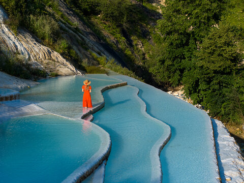 Woman in Red Dress on the Turquoise Travertines Drone Photo, G&ouml;ksu Travertines Dereli, Giresun Turkey (Turkiye)