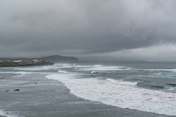 Sea coming in waves on the shore in the Azores of Portugal.
