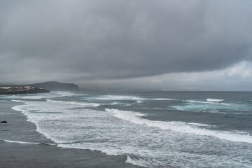 Sea coming in waves on the shore in the Azores of Portugal.