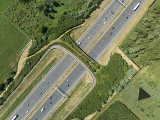 Aerial video of highway with a ecoduct to allow for safe passage of wildlife near Utrecht, The...
