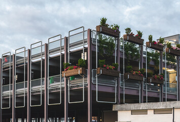 city car park in Stavanger, decorated with various potted flowers