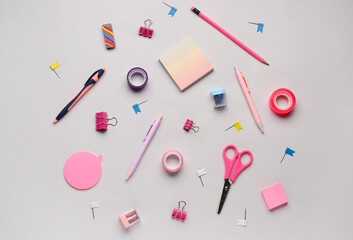 Composition with stationery supplies on grey background