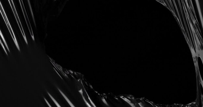 Immerse yourself in tactile wonderland where stretched plastic film converges with velvety black void creating symphony of textures that mirrors delicate intriguing nature of rumpled cellophane wrap.