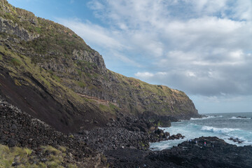 Fototapeta na wymiar The sea meeting the volcanic rocks on the island of Sao Miguel in the Azores. 