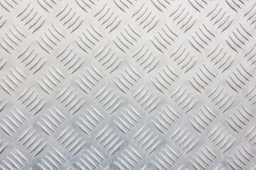 Metal ribbed surface.Metal plate with diamond pattern.Metal with diagonal lines. Steel floor to...