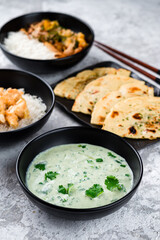 Kefir soup with green, rice with fried chicken fillet, vegetables, tuna shavings and flatbread.