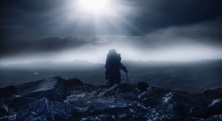 Mountaineering, sport, active lifestyle concept. Silhouette of a man on top of mountain , a journey between heaven and earth.