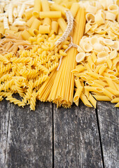 composition of raw Different shapes	 pasta  and Spaghetti 