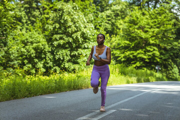 Shot of a sporty young woman running outdoors.