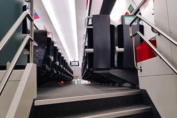Aeroexpress train as urban transportation for travel within city. Seats inside an empty carriage without people