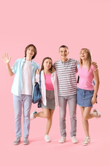 Fototapeta premium Group of teenage students on pink background