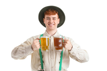 Young man in traditional German clothes with beer on white background
