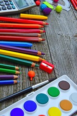 A set of colour pencils and paint supplies 