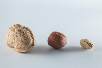 walnut, hazelnut and pistachio, three nuts, of different flavor, texture and size