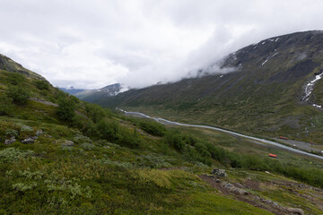 Fototapeta premium Galdhopiggen, Norway - July 3rd, 2023: The mountain landscape on the hike to the peak of Galdhopiggen In Jotunheimen National Park, Norway