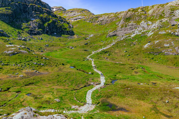 Fototapeta na wymiar Kjerag, Norway - July 5th, 2023: The epic mountain landscape on the famous Kjerag hike in southern Norway
