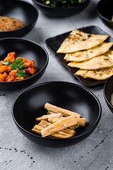 Fuju asparagus marinated in rice vinegar, spicy chicken fillet with chili and Naan flatbread with cilantro.