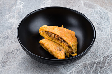 Omelette stuffed with pork, onions, tomatoes, cilantro and chili peppers, fresh breakfast.
