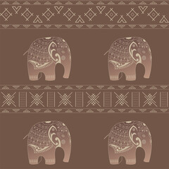 Seamless vector pattern hand drawn of doodle cartoon elephants with ethnic ornaments.