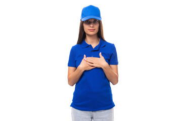 charming young caucasian brunette woman in uniform t-shirt and cap with space for brand print