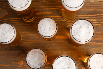 Glasses of cold beer on wooden background. Oktoberfest celebration