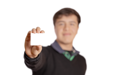 Defocused boy showing a blank card isolated on white background.
