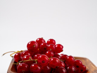 Ripe red currant on a light background. Currant closeup