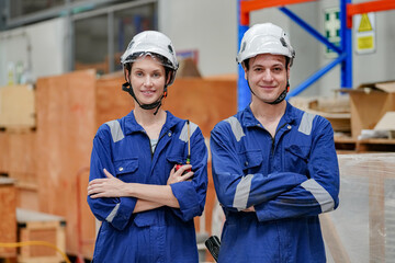 Engineers inspecting locomotive in railway engineering facility