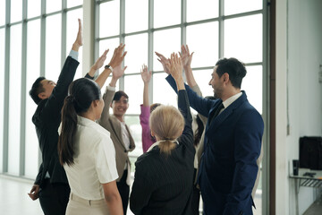Obraz premium Business team stacking hands as symbol of unity