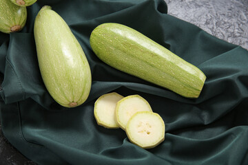 Fresh green zucchini on black background