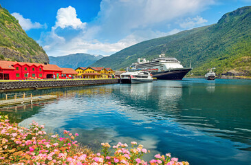 View of wharf in Flam with moored cruise ship. Sognefjord, Aurlandfjord, Norway