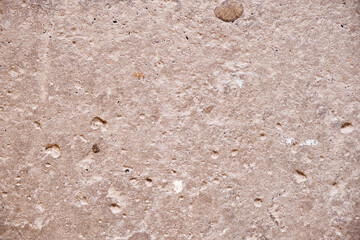 Vintage old concrete wall with various dents. High resolution