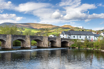 The Crickhowell Bridge, an 18th century arched stone bridge spanning the river Usk in Crickhowell, Brecon Beacons, Powys, Wales, the longest stone bridge in Wales.	