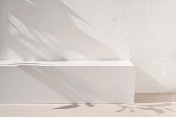 Blank neutral white podium stage with aesthetic abstract floral sun light shadows, textured...