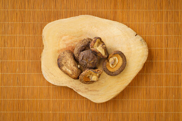 Dried shiitake mushrooms on a monochrome background