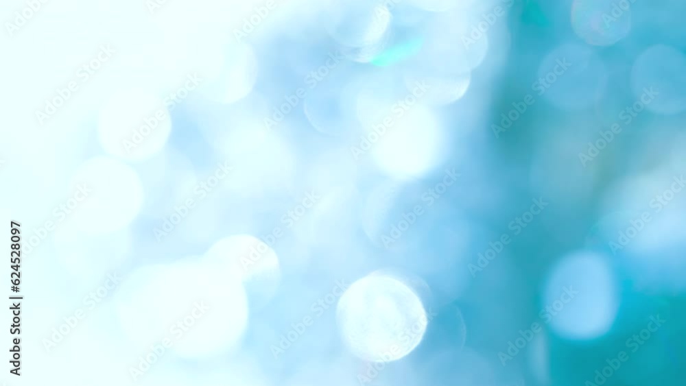 Wall mural slow swirling bokeh in blue space. loop. a large number of sparkling faceted crystals shimmer and cr