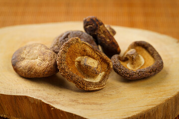 Dried shiitake mushrooms on a monochrome background