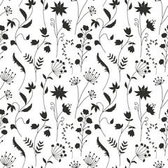 Monochrome seamless pattern with black wild flowers silhouettes on white background. Vintage ditsy floral repeat pattern.