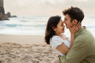 Sweet love story. Loving couple bonding and enjoying time on romantic date on the coastline, free space